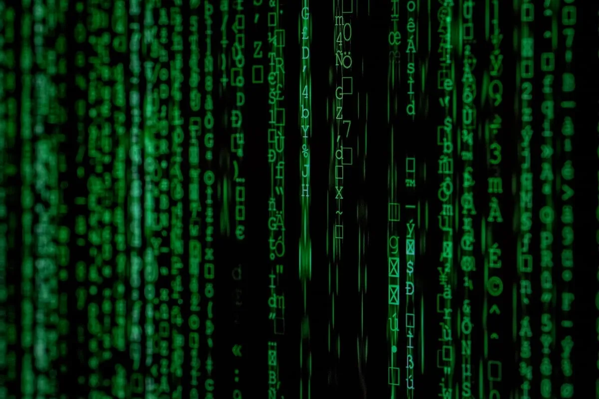 Green matrix-style code streams representing hacking and cyberattack vectors targeting cross-chain bridge infrastructure
